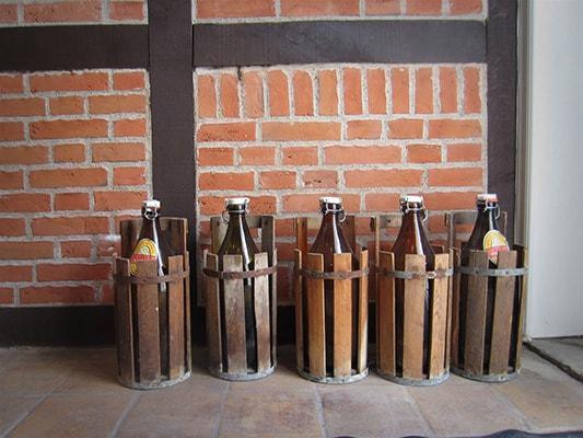 Old bottles used to carry beer from the Ugly Duck brewery, still in use by some of the locals
